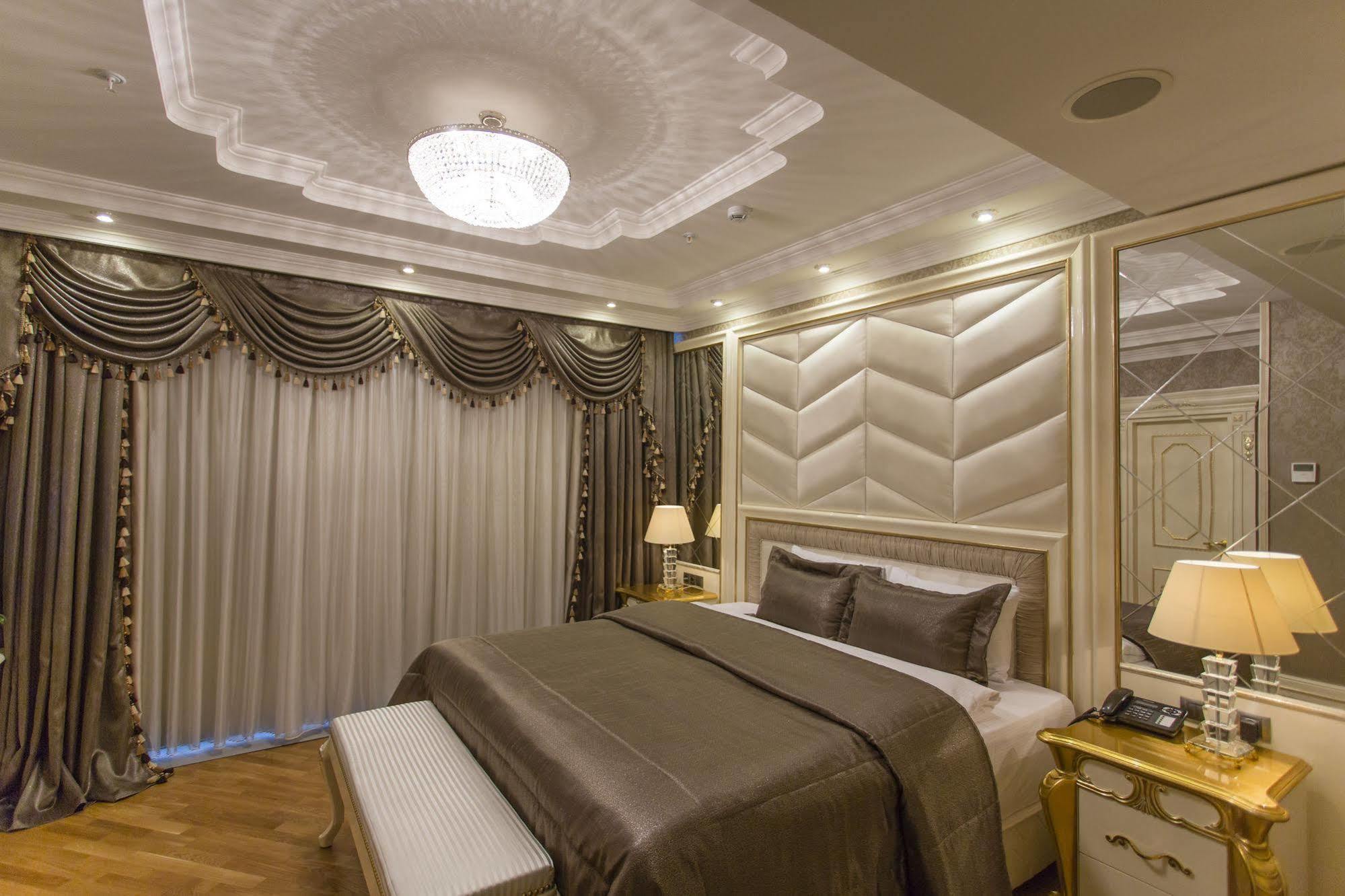 Boutique Hotel Buta Minsk Buitenkant foto A bedroom